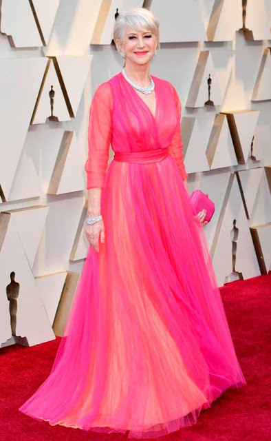 Who said you can't wear pink in your seventies? Helen Mirren looked simply stunning in this V-neck long-sleeve bright pink tulle gown from Schiaparelli
